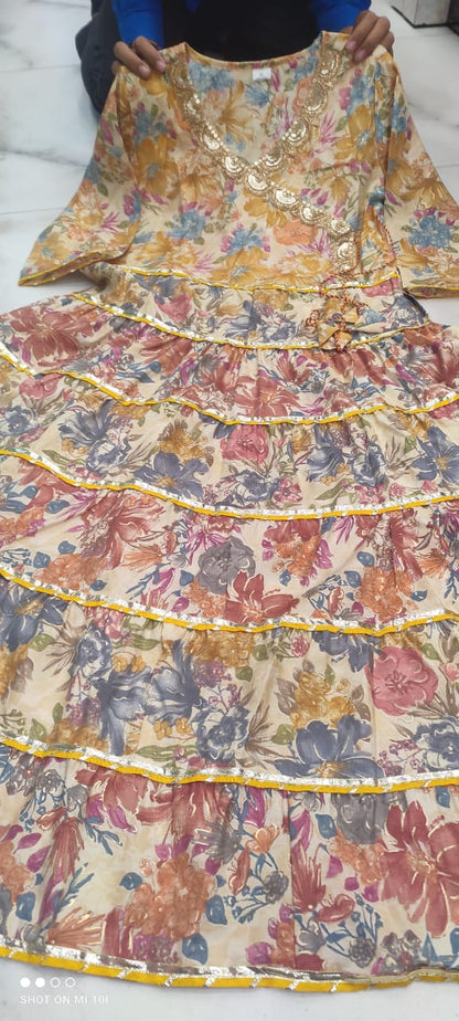 Golden Sequence Muslin Sharara Set with Sidelong Slit Kurti and Chiffon Tie-n-Dye Dupatta