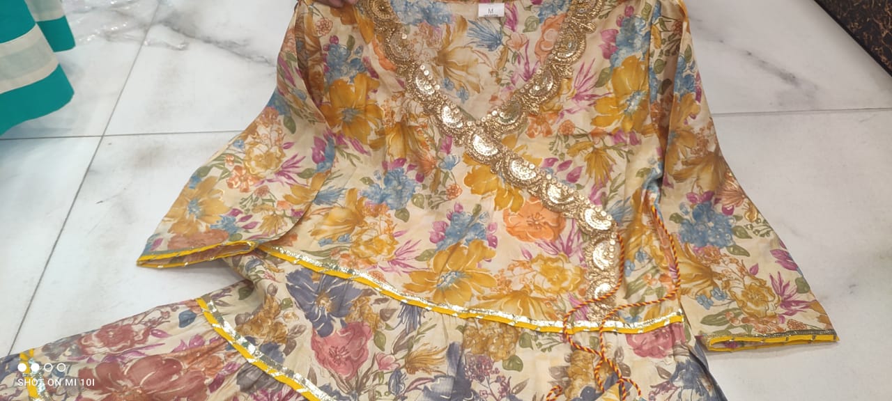 Golden Sequence Muslin Sharara Set with Sidelong Slit Kurti and Chiffon Tie-n-Dye Dupatta