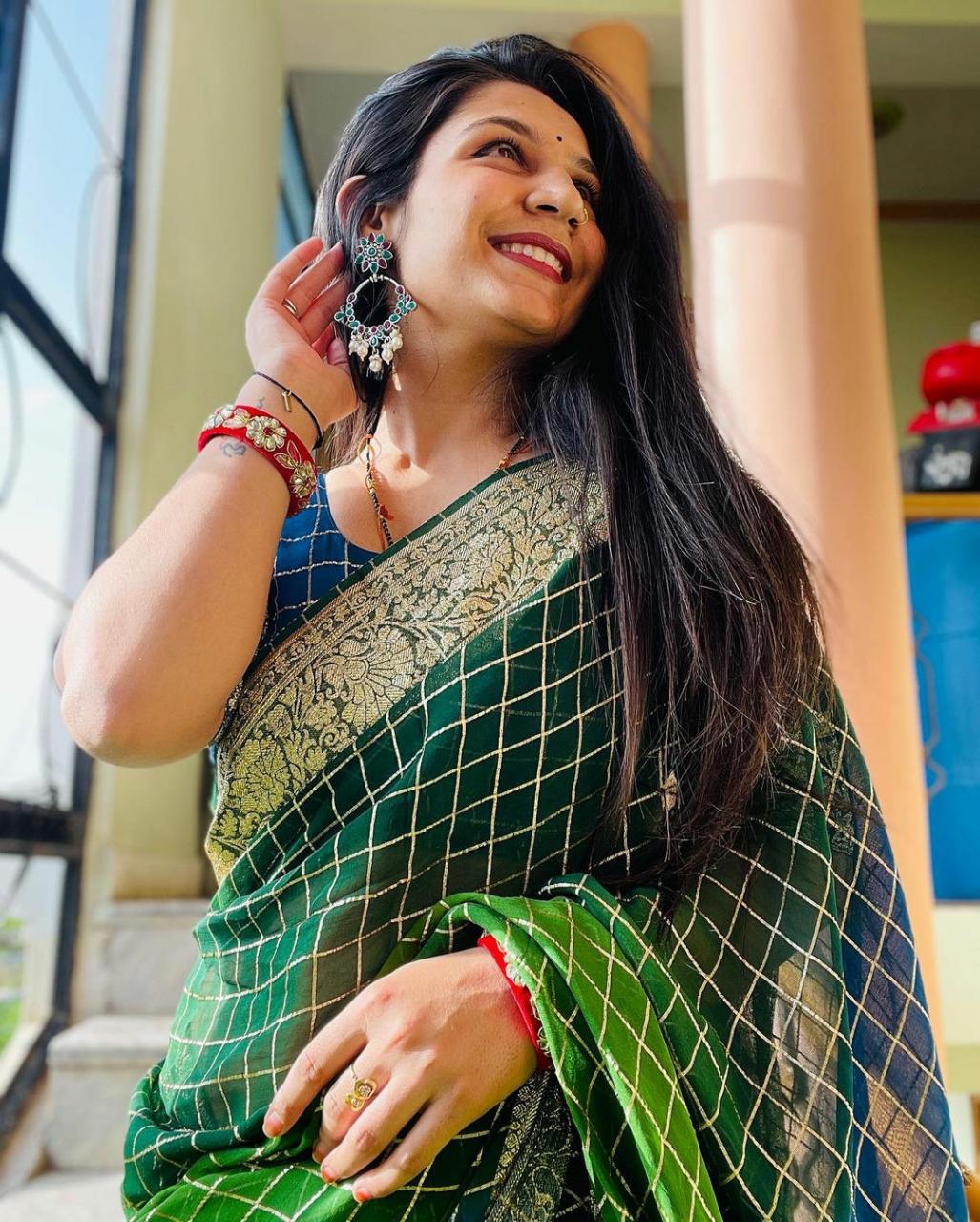 A traditional look with a stunning blue saree paired with a vibrant green  blouse and complemented by a matching green-colored stone neck… | Instagram