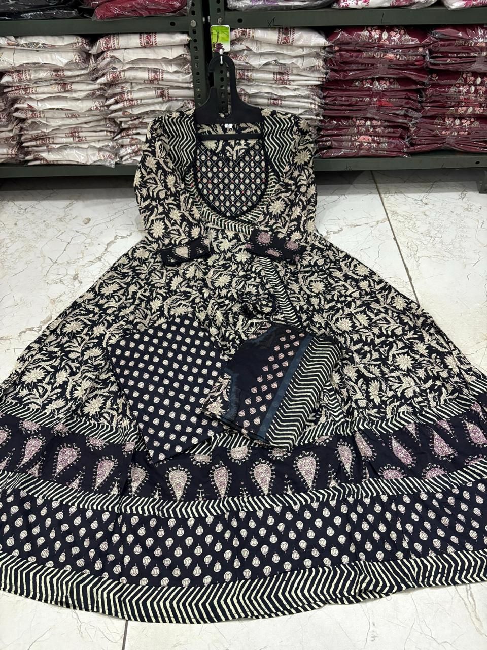 Black and white patterned dress on a mannequin in a store setting