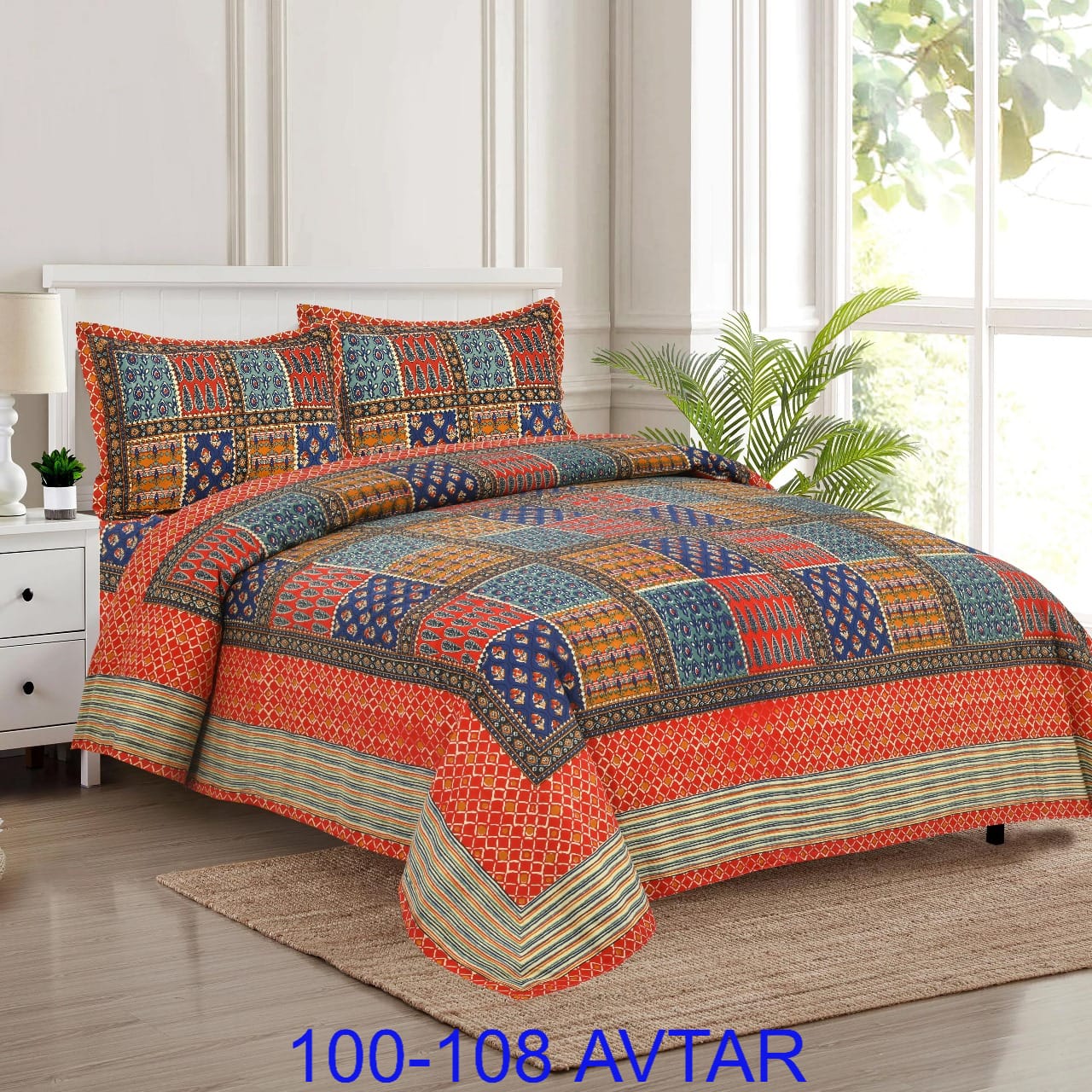 Colorful patchwork quilt set on a bed in a bedroom with a plant and nightstand.