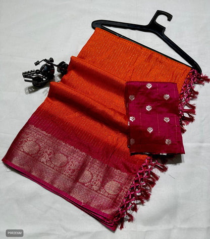 Red and orange saree with a pink border on a white background