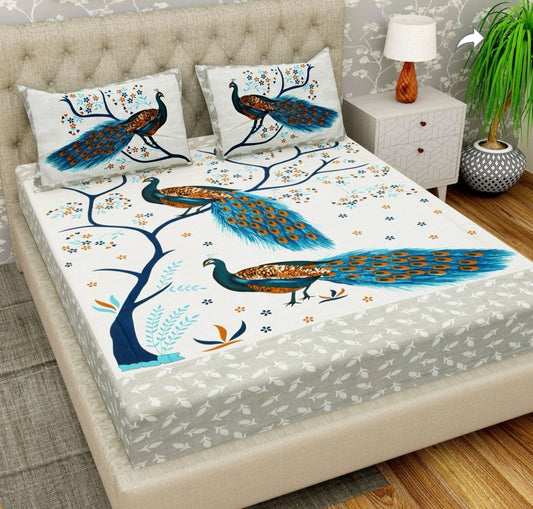 Bedding set with peacock design on a bed in a room setting.