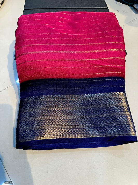 Folded fabric with red and blue pattern on a white surface