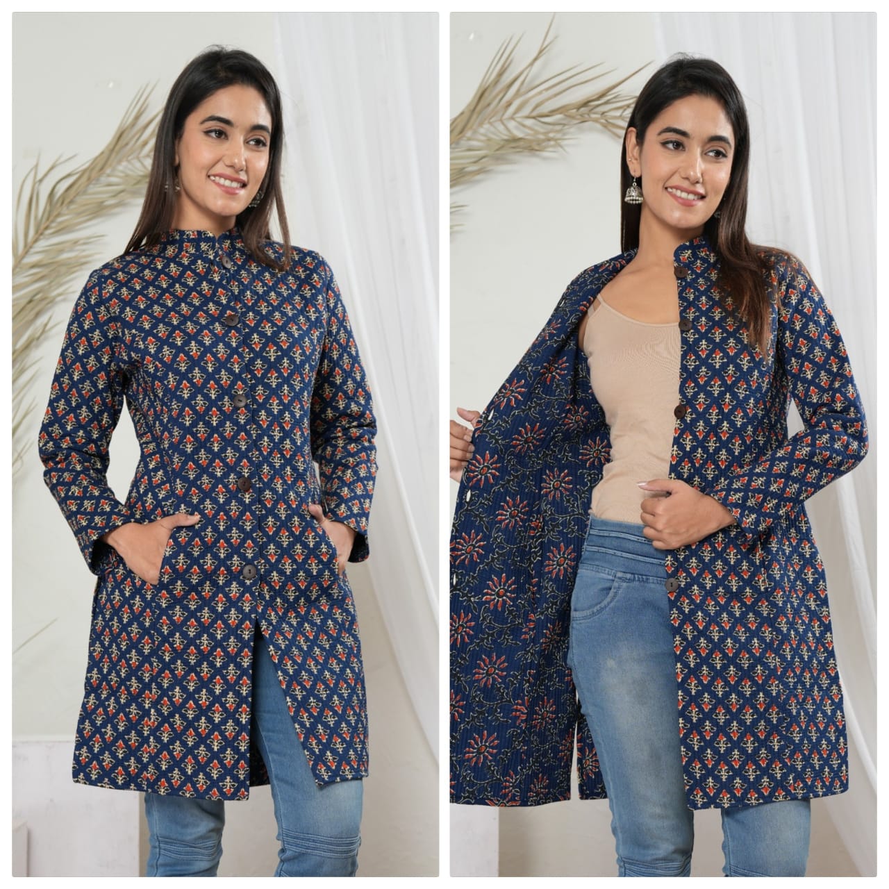 Woman wearing a blue patterned coat over a beige top and jeans, standing against a white background.